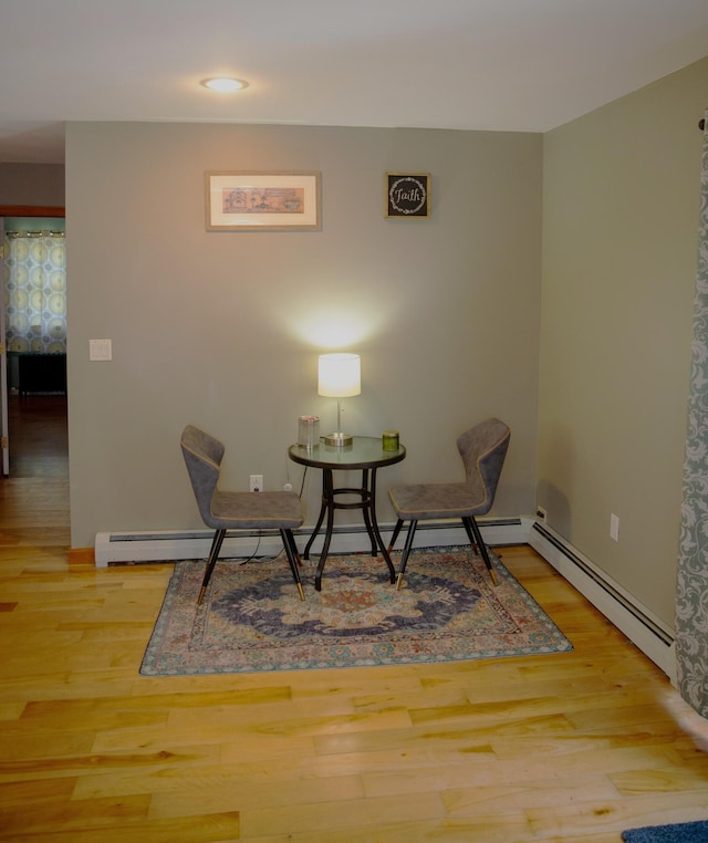 51 Brookview Dr, Bucksport, ME 04416 - living area featuring wood finished floors and a baseboard heating unit