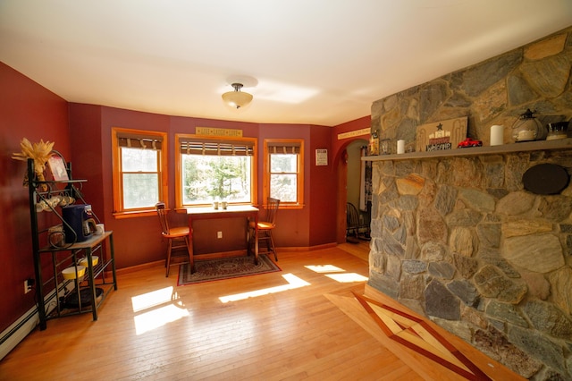 51 Brookview Dr, Bucksport, ME 04416 - sitting room with arched walkways and hardwood / wood-style flooring