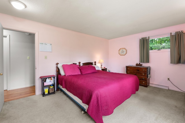 55 Woodland St, Fryeburg, ME 04037 - carpeted bedroom with a baseboard heating unit