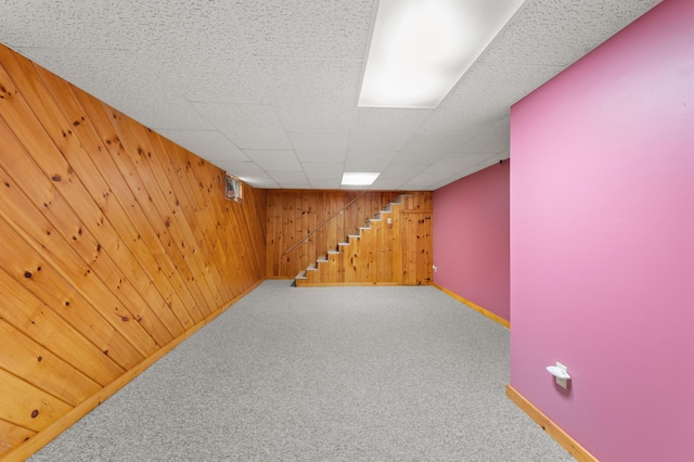 55 Woodland St, Fryeburg, ME 04037 - finished basement featuring wood walls, baseboards, carpet flooring, and stairs
