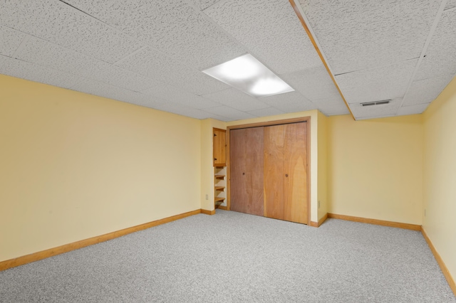 55 Woodland St, Fryeburg, ME 04037 - unfurnished bedroom featuring carpet floors, baseboards, a closet, and a drop ceiling