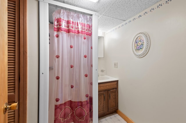 55 Woodland St, Fryeburg, ME 04037 - bathroom featuring a paneled ceiling, vanity, baseboards, and a shower with shower curtain
