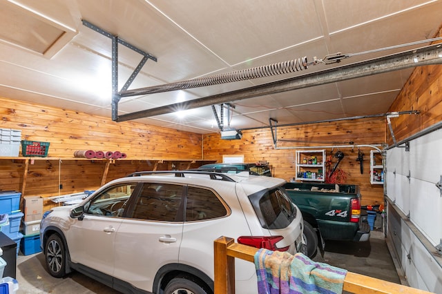 55 Woodland St, Fryeburg, ME 04037 - garage featuring wood walls and a garage door opener