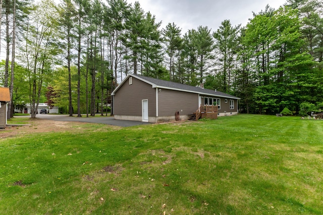 55 Woodland St, Fryeburg, ME 04037 - view of side of home with a yard and view of scattered trees