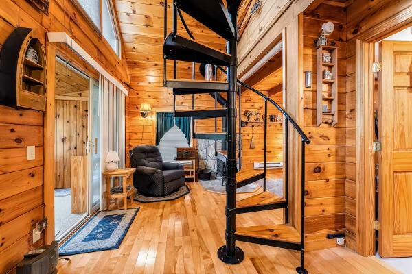 19 Birch Ests, Rome, ME 04963 - stairs with wooden walls and hardwood / wood-style floors