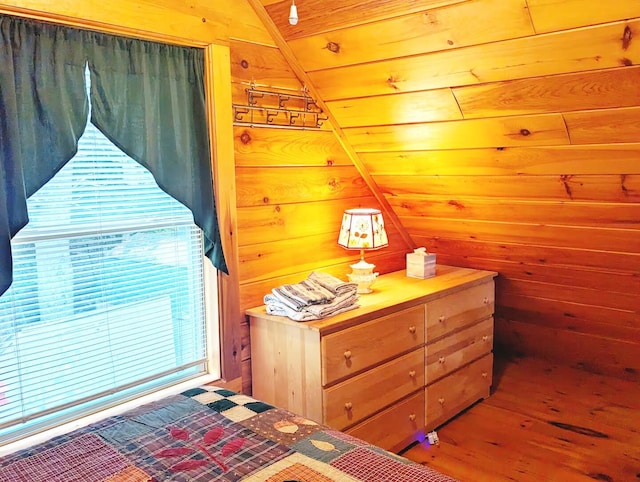 19 Birch Ests, Rome, ME 04963 - bedroom featuring wood walls, wood finished floors, and vaulted ceiling