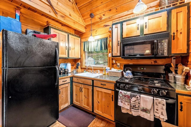 19 Birch Ests, Rome, ME 04963 - kitchen featuring black appliances, a sink, wood walls, dark wood-style flooring, and tile counters
