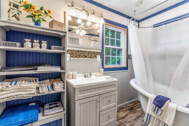 19 Birch Ests, Rome, ME 04963 - full bath with wood finished floors, a tub, vanity, curtained shower, and a ceiling fan