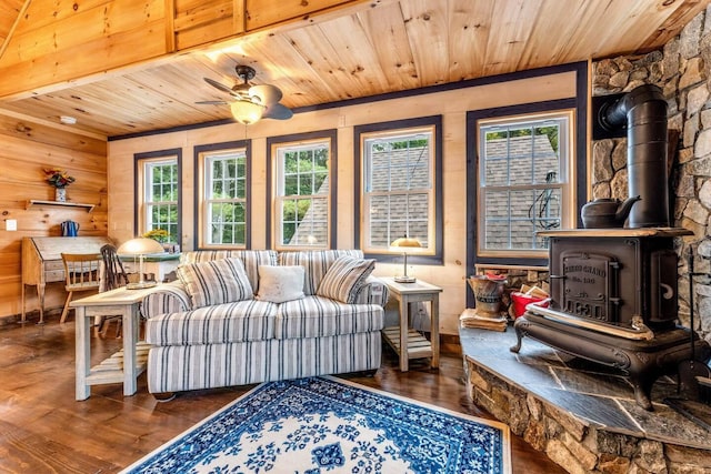 19 Birch Ests, Rome, ME 04963 - living area with a wood stove, wooden ceiling, hardwood / wood-style floors, ceiling fan, and wooden walls