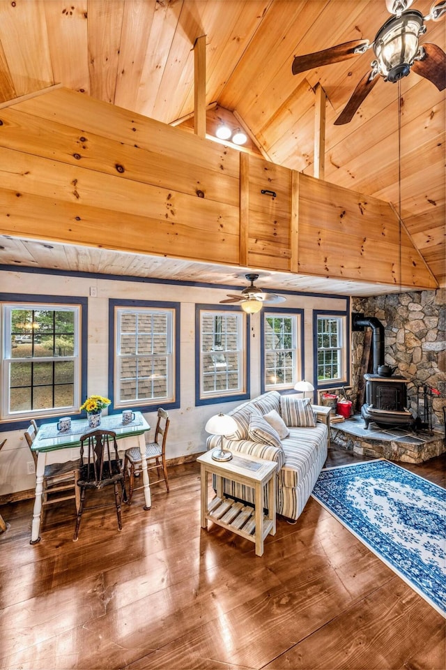 19 Birch Ests, Rome, ME 04963 - living area with a wood stove, wooden ceiling, a ceiling fan, vaulted ceiling, and wood-type flooring