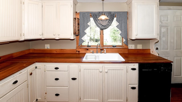 43 Main St, Harrison, ME 04040 - kitchen with black dishwasher, a sink, butcher block countertops, white cabinets, and pendant lighting