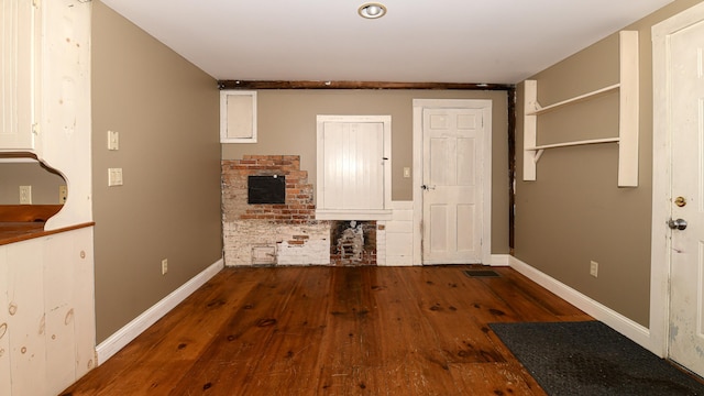 43 Main St, Harrison, ME 04040 - entryway with hardwood / wood-style floors, baseboards, and a fireplace