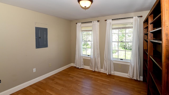 43 Main St, Harrison, ME 04040 - spare room with electric panel, baseboards, and wood finished floors