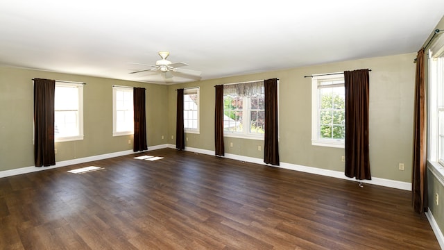 43 Main St, Harrison, ME 04040 - empty room with dark wood-style floors, baseboards, and a ceiling fan