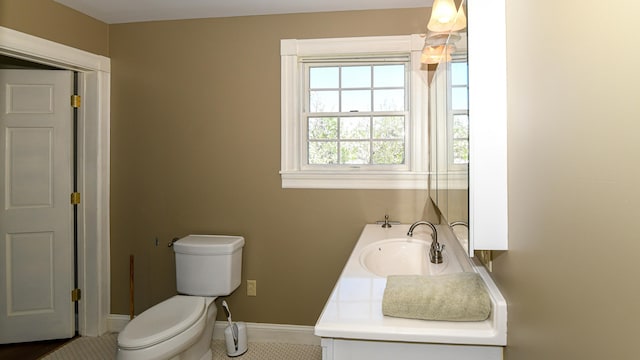 43 Main St, Harrison, ME 04040 - bathroom featuring toilet, baseboards, vanity, and tile patterned flooring