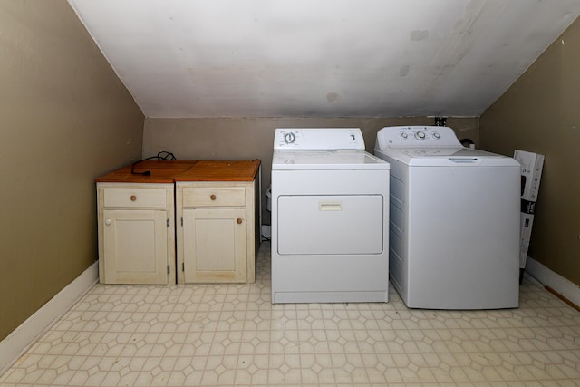 43 Main St, Harrison, ME 04040 - clothes washing area featuring light floors, cabinet space, washing machine and clothes dryer, and baseboards
