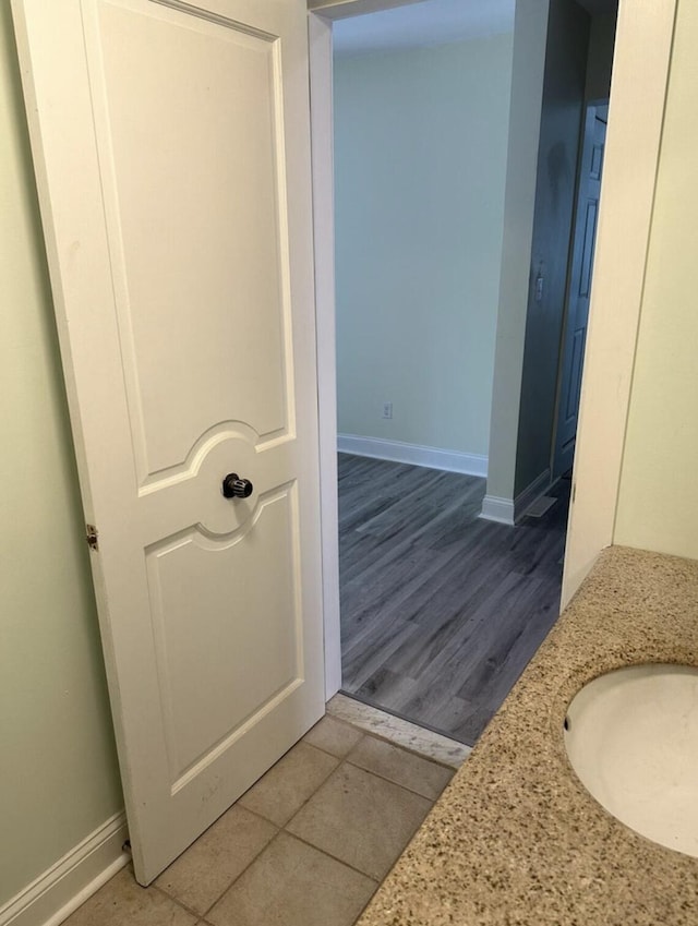 30 Elm St, Fort Kent, ME 04743 - bathroom with baseboards, tile patterned floors, and vanity