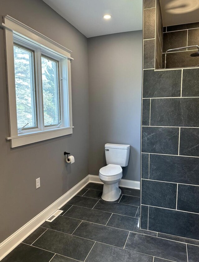 30 Elm St, Fort Kent, ME 04743 - full bath featuring toilet, baseboards, a tile shower, tile patterned floors, and recessed lighting