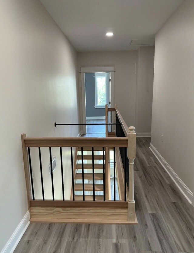 30 Elm St, Fort Kent, ME 04743 - stairs featuring baseboards, wood finished floors, attic access, and recessed lighting