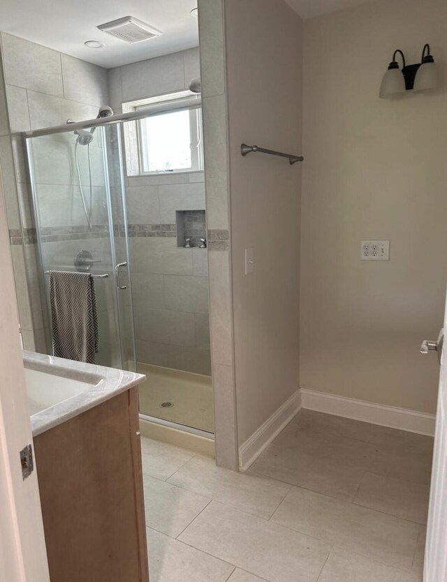 30 Elm St, Fort Kent, ME 04743 - full bathroom featuring baseboards, a shower stall, vanity, and tile patterned flooring