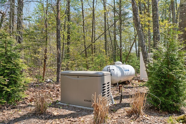 6 Roberts Ln, Kennebunkport, ME 04046 - exterior view of a power unit, propane tank, and a forest view