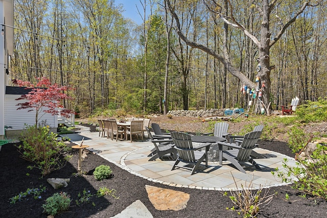 6 Roberts Ln, Kennebunkport, ME 04046 - view of patio / terrace featuring a fire pit and a wooded view