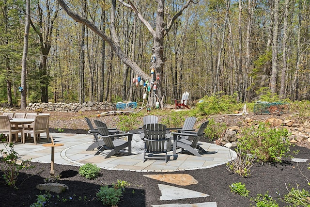 6 Roberts Ln, Kennebunkport, ME 04046 - view of patio / terrace with a fire pit and a forest view