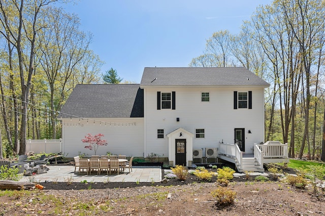 6 Roberts Ln, Kennebunkport, ME 04046 - back of house featuring a patio area, a wooden deck, fence, and roof with shingles