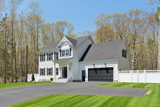 6 Roberts Ln, Kennebunkport, ME 04046 - view of front facade with an attached garage, asphalt driveway, and roof with shingles