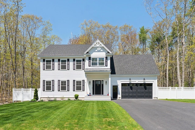 6 Roberts Ln, Kennebunkport, ME 04046 - view of front facade with a garage, asphalt driveway, board and batten siding, and a shingled roof