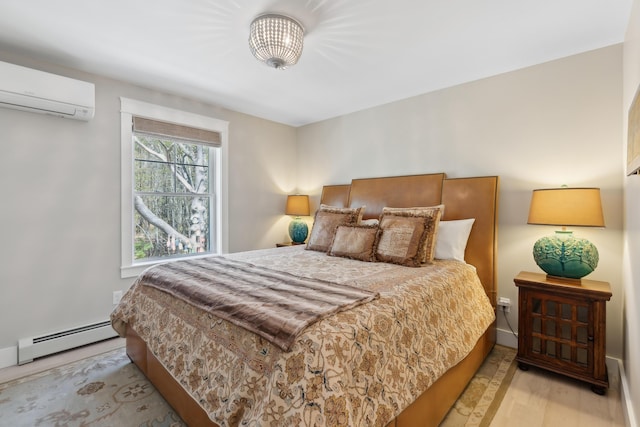 6 Roberts Ln, Kennebunkport, ME 04046 - bedroom with a baseboard radiator, a wall unit AC, and wood finished floors