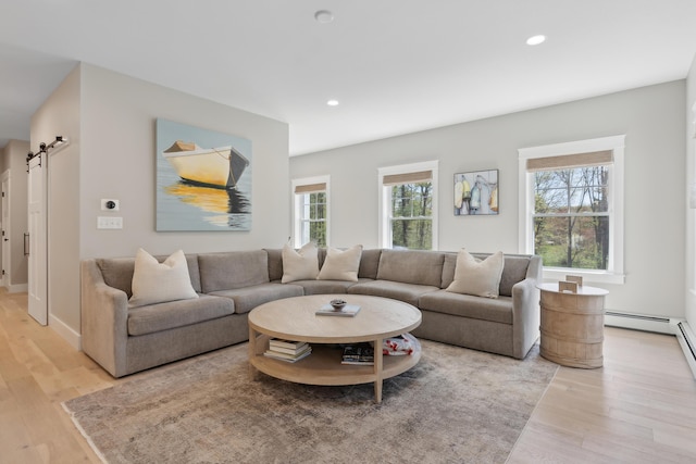 6 Roberts Ln, Kennebunkport, ME 04046 - living room with a barn door, light wood-style floors, and recessed lighting