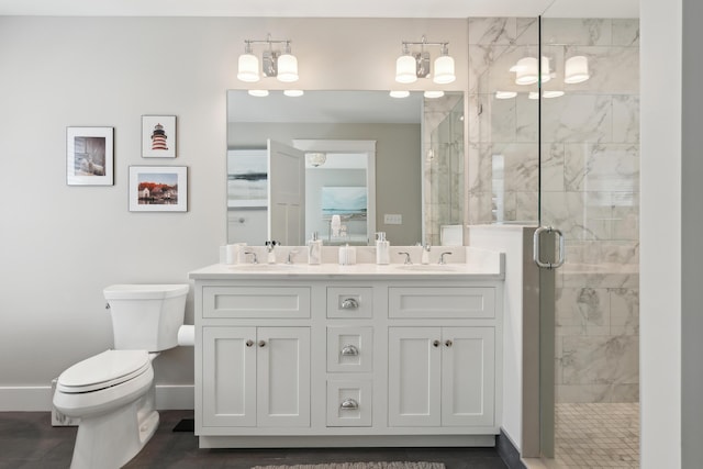6 Roberts Ln, Kennebunkport, ME 04046 - bathroom with baseboards, a shower stall, toilet, and double vanity
