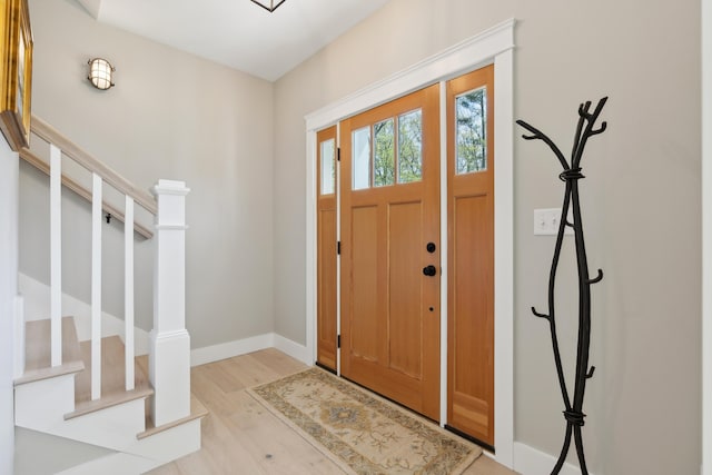 6 Roberts Ln, Kennebunkport, ME 04046 - foyer entrance with wood finished floors, stairway, and baseboards