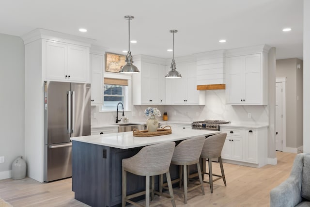 6 Roberts Ln, Kennebunkport, ME 04046 - kitchen featuring freestanding refrigerator, a sink, light countertops, white cabinets, and decorative backsplash