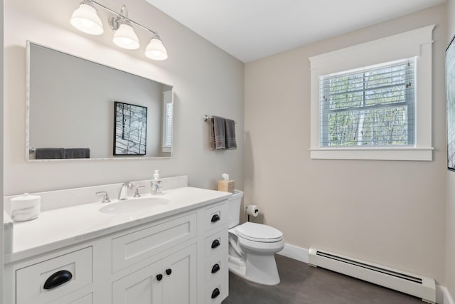 6 Roberts Ln, Kennebunkport, ME 04046 - bathroom featuring a baseboard radiator, toilet, vanity, and baseboards