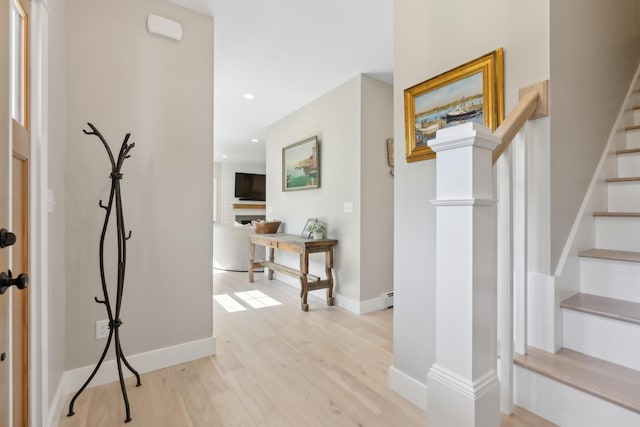 6 Roberts Ln, Kennebunkport, ME 04046 - hall featuring light wood-style flooring, stairway, baseboards, recessed lighting, and a baseboard radiator