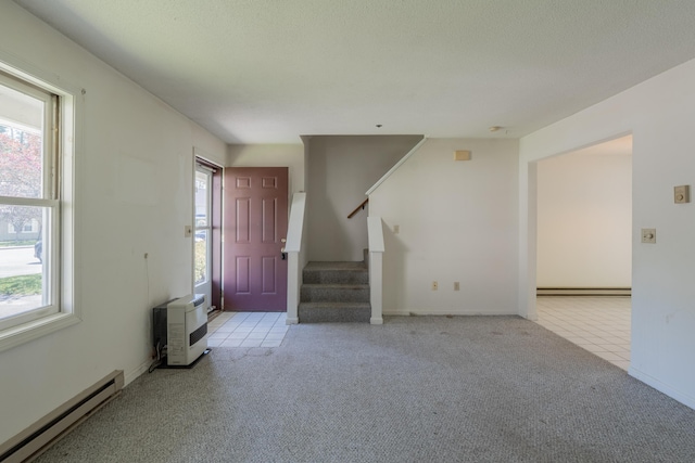 48 Pine Hill Dr Unit 48, Bath, ME 04530 - unfurnished living room with a baseboard radiator, carpet, stairs, and baseboards