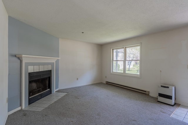48 Pine Hill Dr Unit 48, Bath, ME 04530 - unfurnished living room with baseboard heating, heating unit, a tile fireplace, a textured ceiling, and carpet