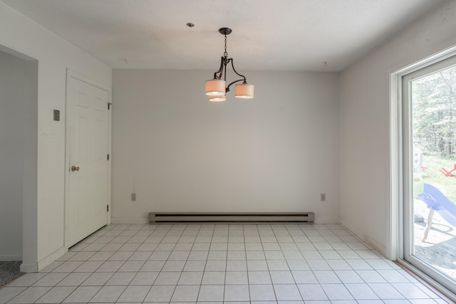 48 Pine Hill Dr Unit 48, Bath, ME 04530 - unfurnished room with a baseboard radiator, light tile patterned floors, a chandelier, and baseboards