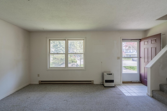 48 Pine Hill Dr Unit 48, Bath, ME 04530 - unfurnished living room with carpet floors, stairs, healthy amount of natural light, a textured ceiling, and a baseboard radiator