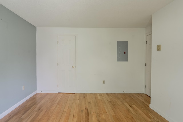 48 Pine Hill Dr Unit 48, Bath, ME 04530 - spare room with electric panel, light wood-style floors, and baseboards