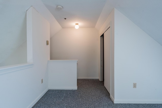 48 Pine Hill Dr Unit 48, Bath, ME 04530 - spare room with carpet flooring, vaulted ceiling, baseboards, and a smoke detector