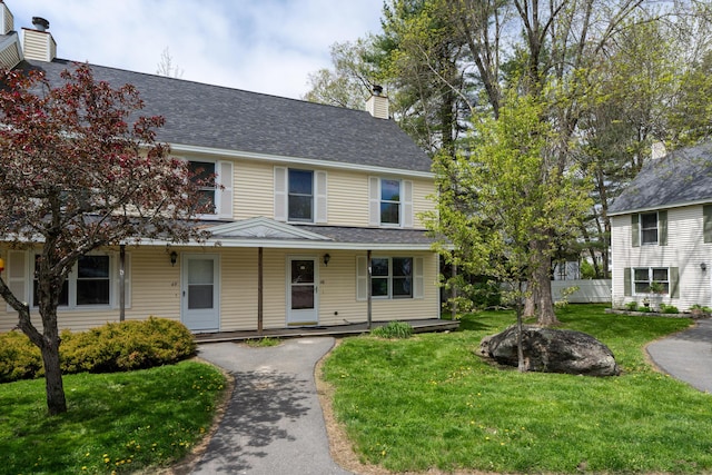 48 Pine Hill Dr Unit 48, Bath, ME 04530 - view of front of property featuring a chimney, a shingled roof, and a porch