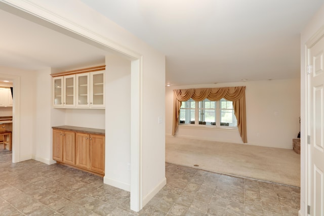 359 Beech Plains Rd, Buxton, ME 04093 - corridor with stone finish floors, light carpet, and baseboards