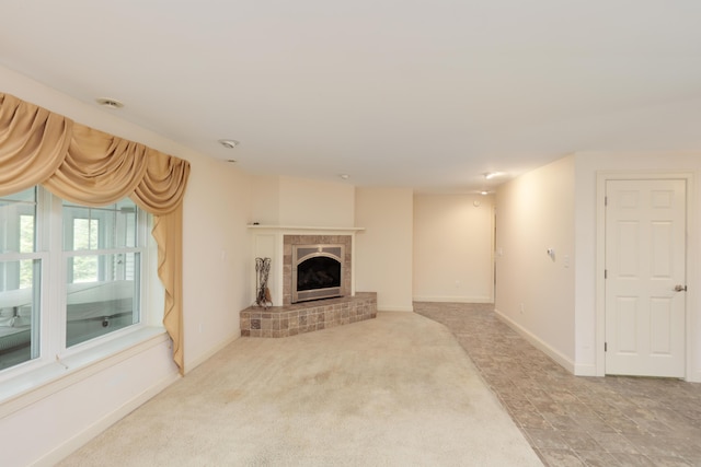 359 Beech Plains Rd, Buxton, ME 04093 - unfurnished living room with a fireplace, baseboards, and carpet flooring