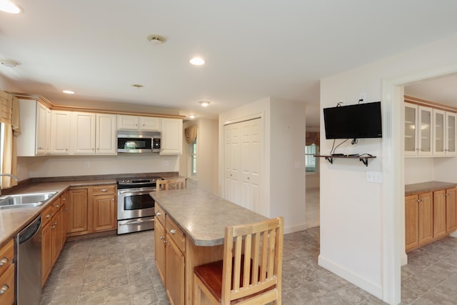 359 Beech Plains Rd, Buxton, ME 04093 - kitchen featuring stainless steel appliances, a sink, a kitchen island, recessed lighting, and baseboards