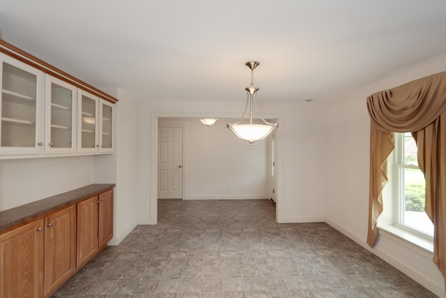 359 Beech Plains Rd, Buxton, ME 04093 - unfurnished dining area featuring baseboards and stone finish floors