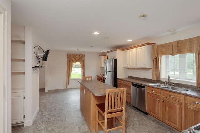 359 Beech Plains Rd, Buxton, ME 04093 - kitchen with appliances with stainless steel finishes, a sink, a center island, recessed lighting, and a kitchen breakfast bar