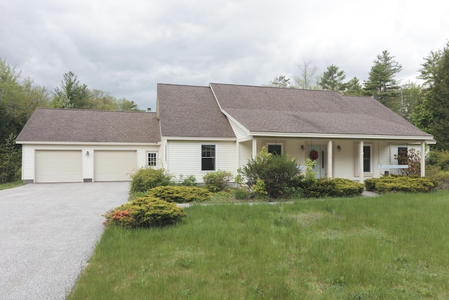 359 Beech Plains Rd, Buxton, ME 04093 - view of front of house featuring asphalt driveway, a garage, a porch, and roof with shingles